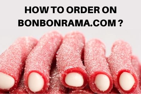 front-close-view-candy-composition-different-colored-candies-with-marshmallow-white-desk.jpg